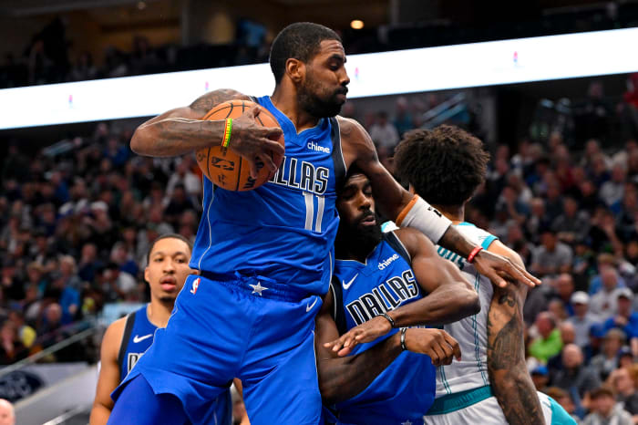 Kyrie Irving snags a rebound in the Dallas Mavericks’ win over the Charlotte Hornets on Sunday.